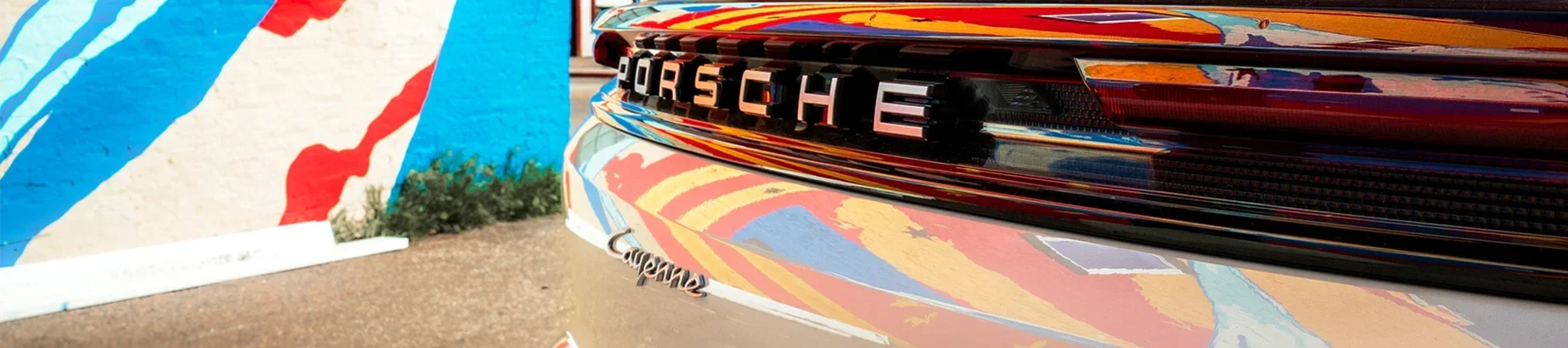 Porsche Allocation form featuring a white Cayenne in downtown Bentonville, Arkansas.