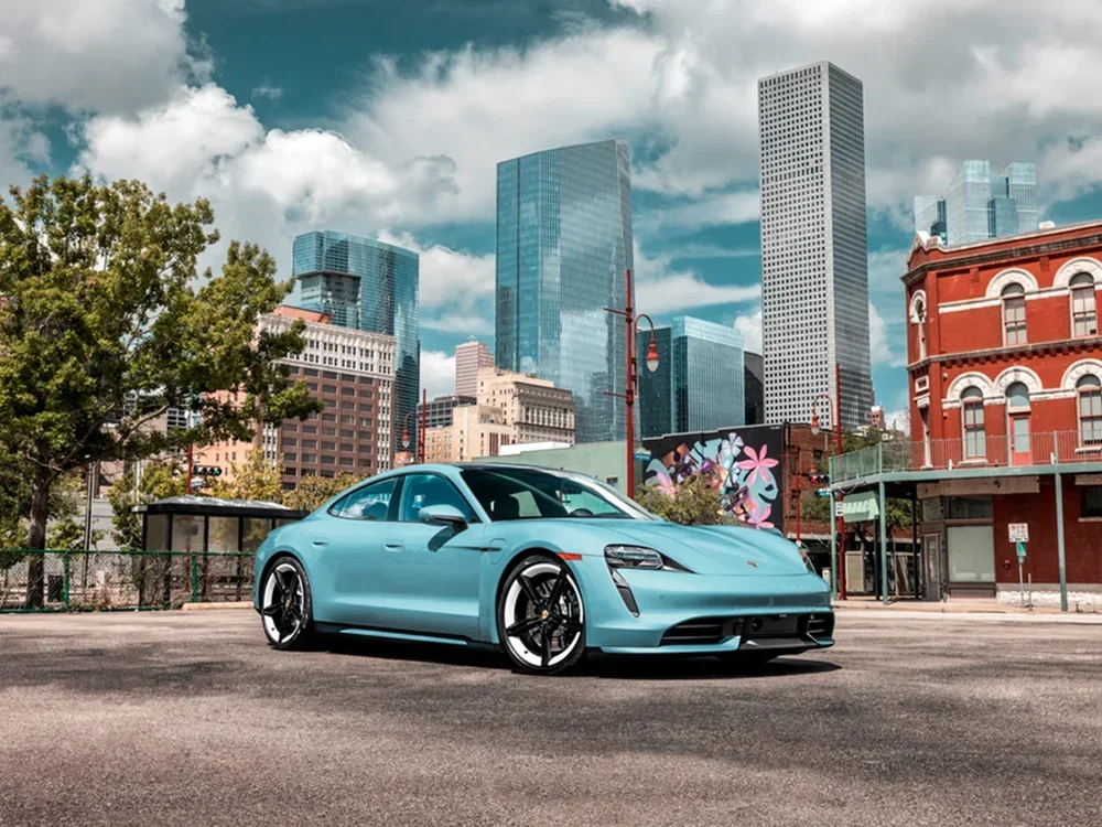 Frozen blue Porsche Taycan in downtown Boulder, CO